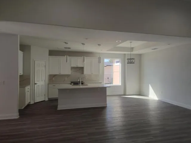 a view of kitchen with sink microwave and stove