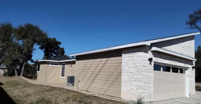 a backyard of a house with lots of green space