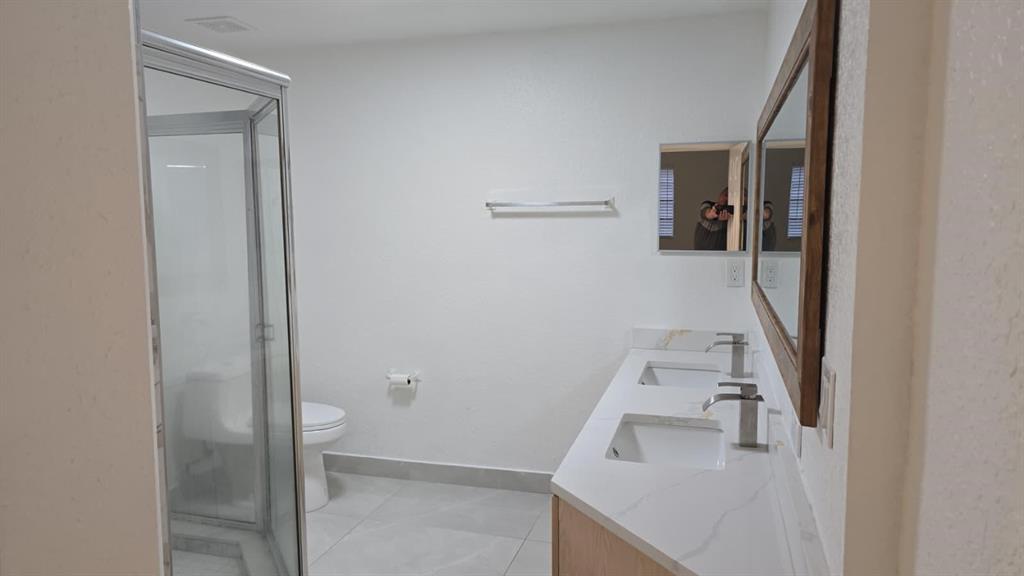 2801 Riverside Drive, Unit 104 Coral Springs, FL 33065 - Photo 11 of 22 a bathroom with a sink and mirror