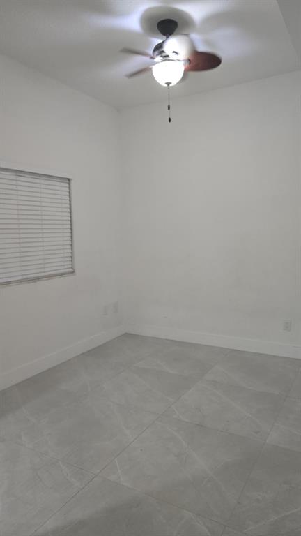 2801 Riverside Drive, Unit 104 Coral Springs, FL 33065 - Photo 7 of 22 a view of an empty room with a window