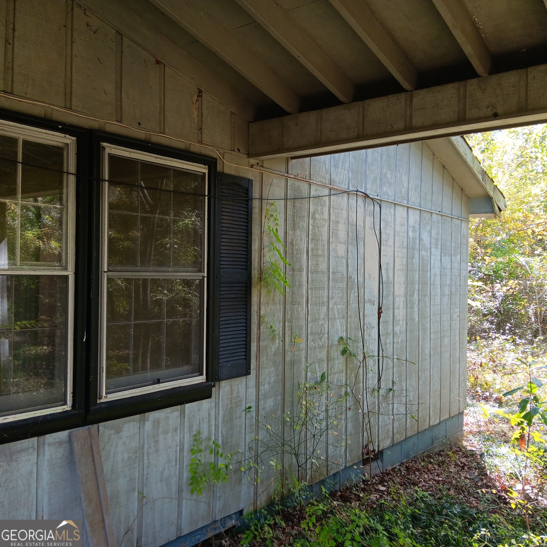 4377 Rock Mills Road LaGrange, GA 30240 - Photo 4 of 27 a view of a back yard from a glass door