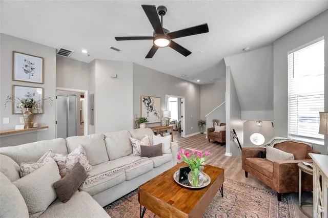 a living room with furniture and a large window