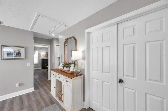 a bedroom with furniture and a wooden floor