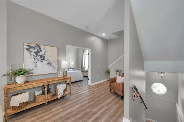 a living room with furniture and stairs