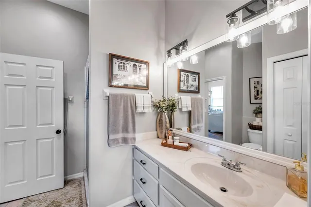 a bathroom with 2 sink and a mirror