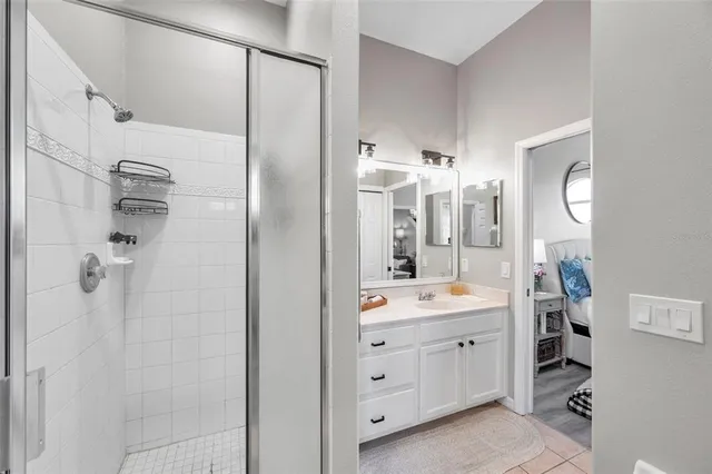 a bathroom with a double vanity sink mirror double and shower