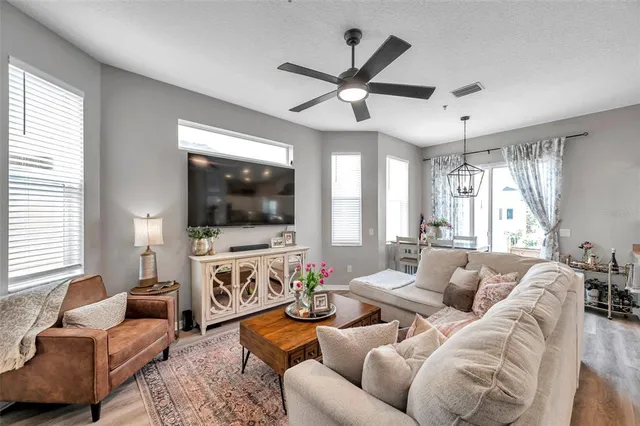 a living room with furniture fireplace and a flat screen tv