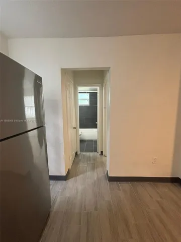 a view of a livingroom with wooden floor