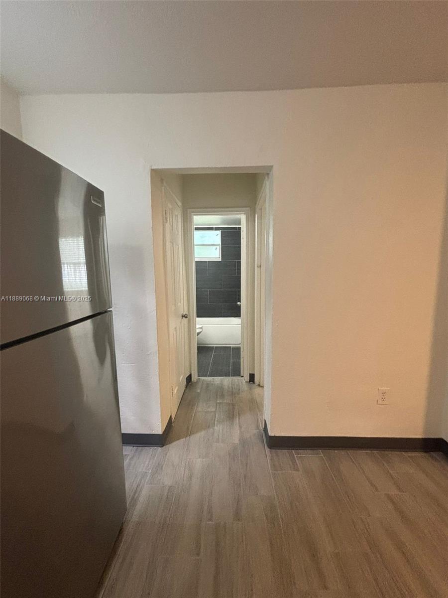 708 Northwest 4th Avenue, Unit 4 Miami, FL 33136 - Photo 8 of 17 a view of a livingroom with wooden floor