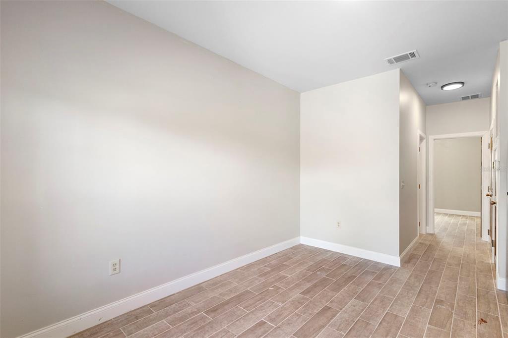 4460 North Fort Christmas Road, Unit 3 Christmas, FL 32820 - Photo 11 of 15 a view of a room with wooden floor