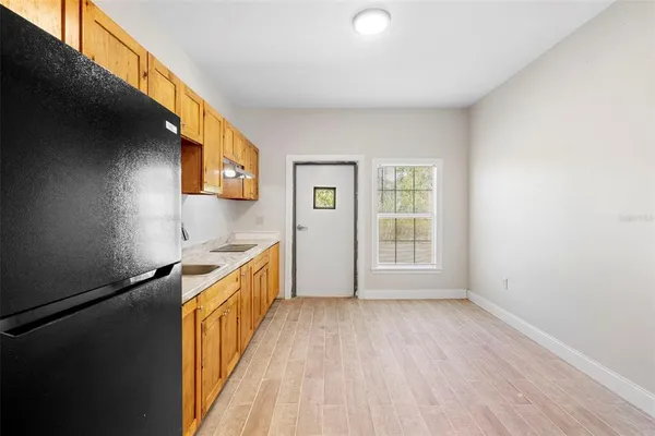 a view of a kitchen with a sink and dishwasher