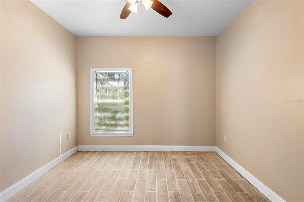 4460 North Fort Christmas Road, Unit 3 Christmas, FL 32820 - Photo 7 of 15 an empty room with a window
