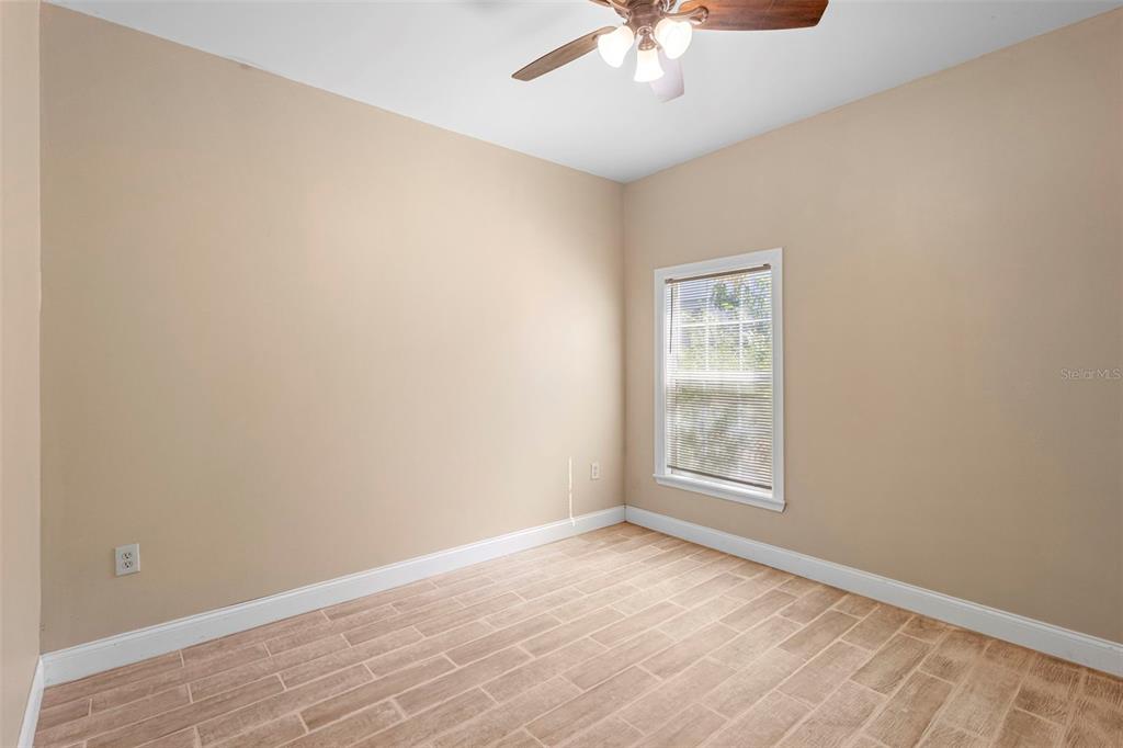 4460 North Fort Christmas Road, Unit 3 Christmas, FL 32820 - Photo 8 of 15 an empty room with a window