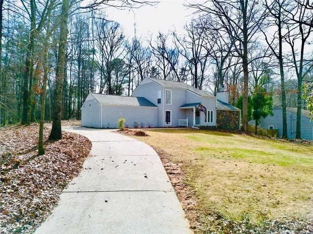 a view of a house with snow on the background