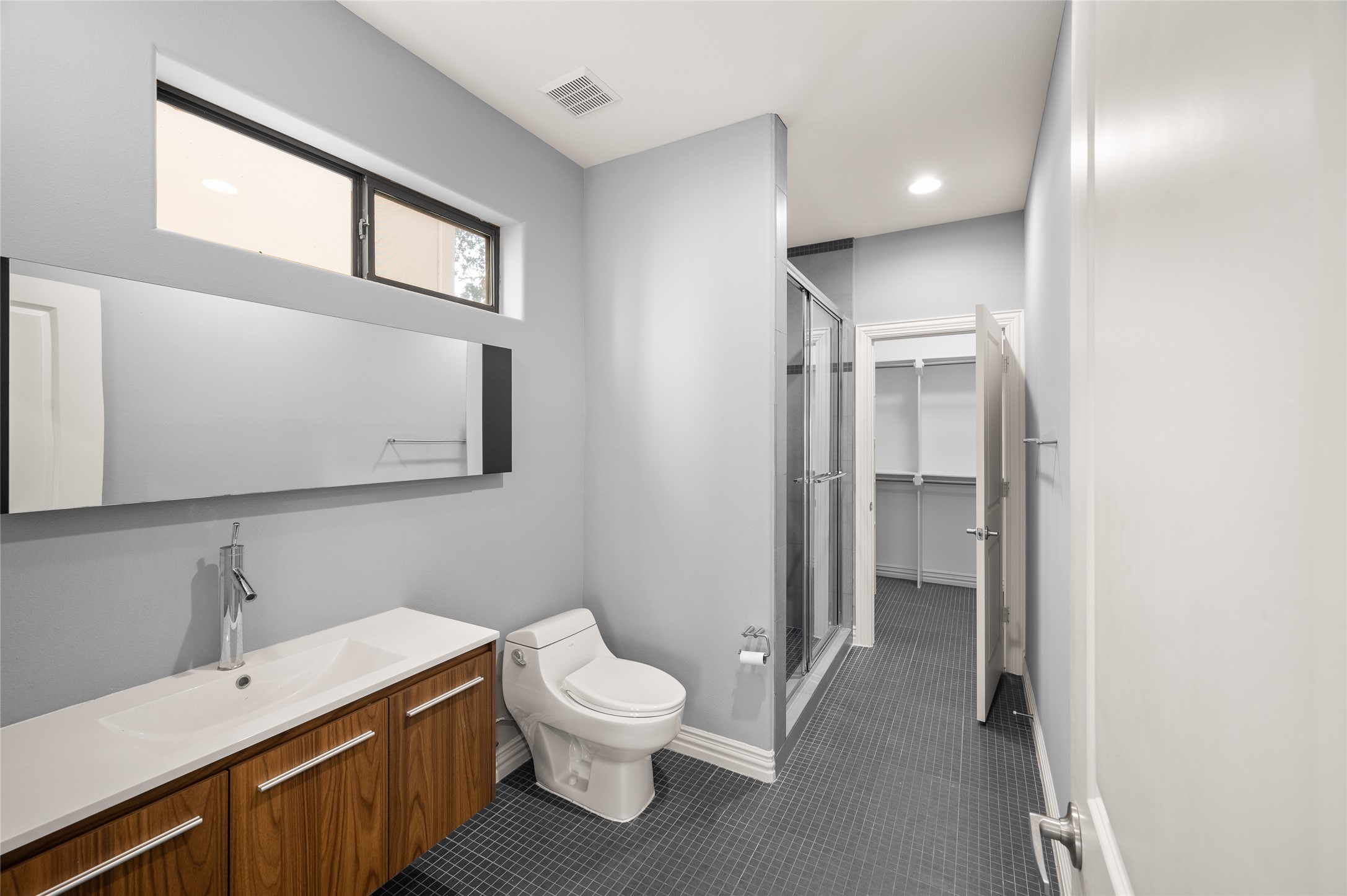 2310 Camden Drive Houston, TX 77021 - Photo 11 of 39 a bathroom with a toilet sink and mirror