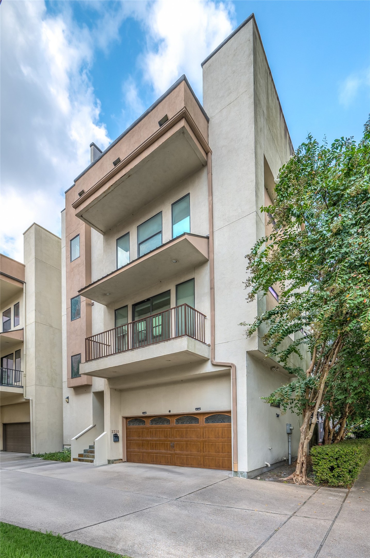 2310 Camden Drive Houston, TX 77021 - Photo 2 of 39 a front view of a house with a yard and garage
