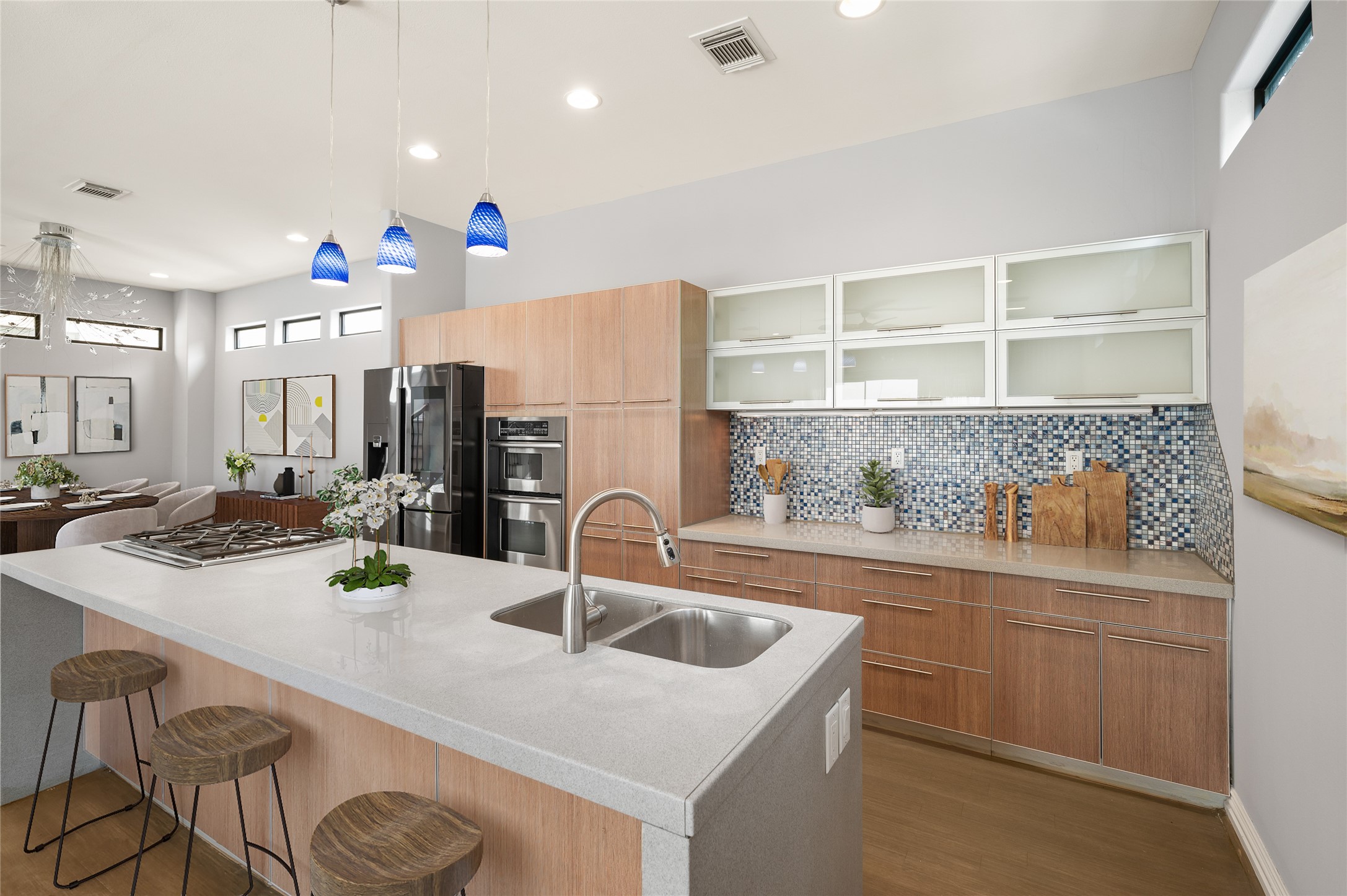 2310 Camden Drive Houston, TX 77021 - Photo 25 of 39 a kitchen with a sink a stove and chairs