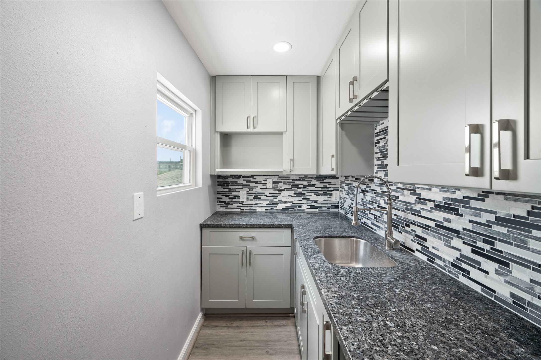 2310 Camden Drive Houston, TX 77021 - Photo 37 of 39 a kitchen with a sink stove and cabinets