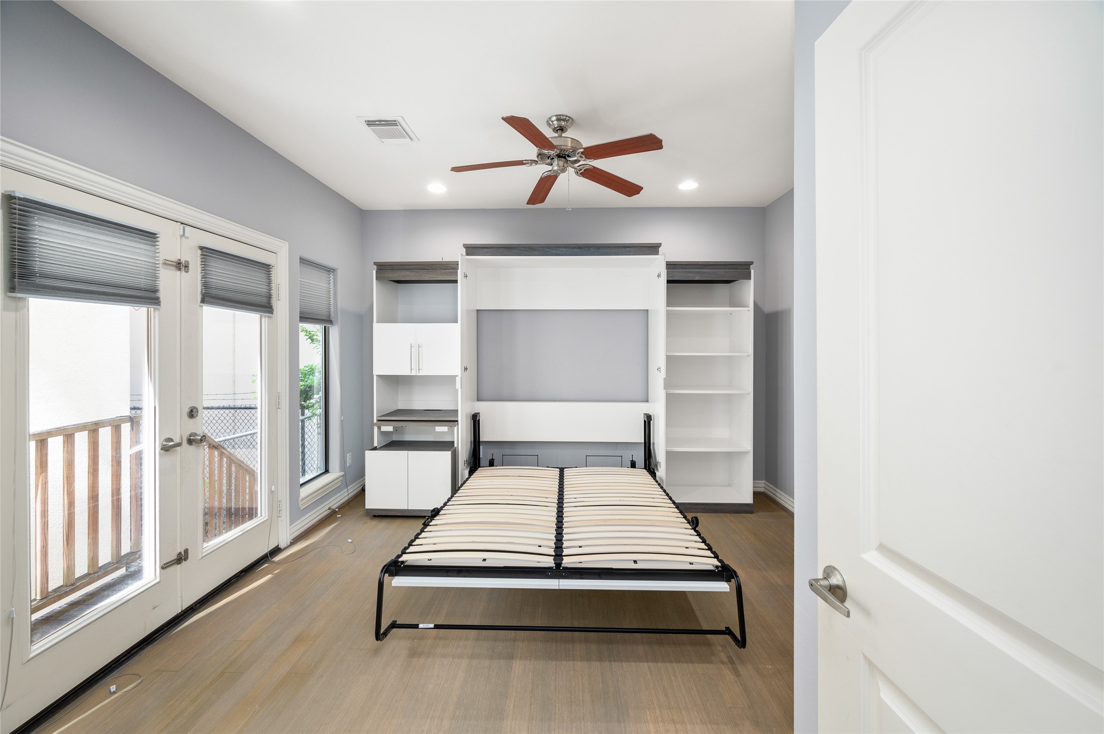 2310 Camden Drive Houston, TX 77021 - Photo 9 of 39 a bedroom with a bed and a large window