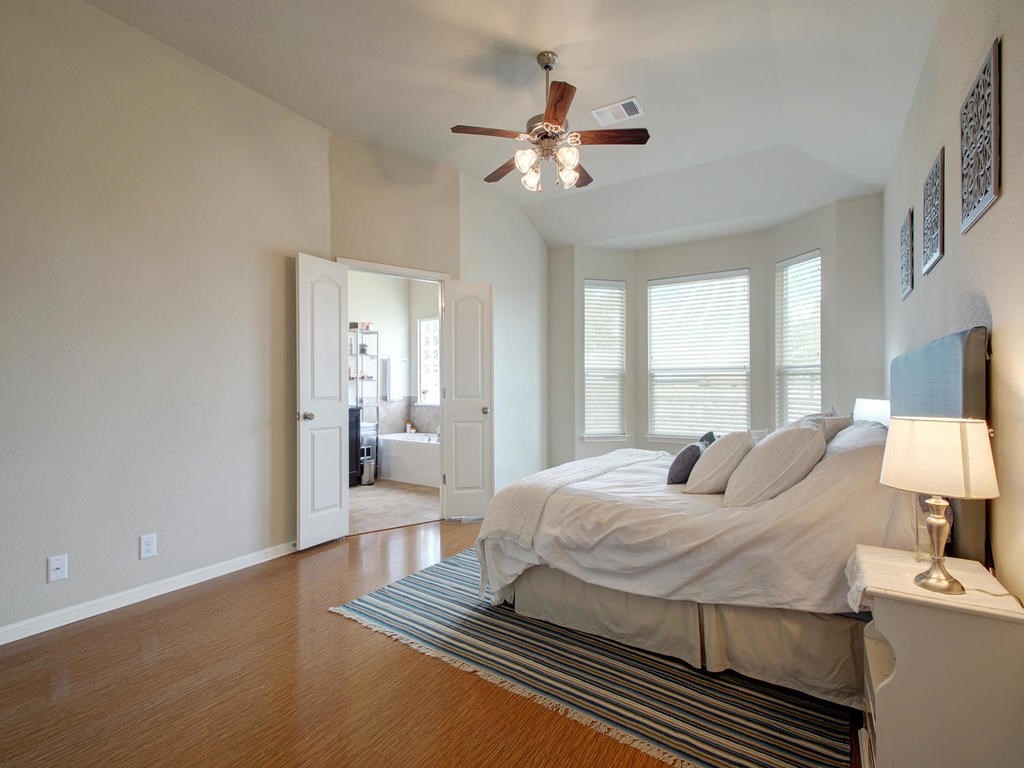 13900 Marathon Road Austin, TX 78717 - Photo 15 of 30 Master bedroom with bamboo flooring, this photo is from when owner lived in the home.