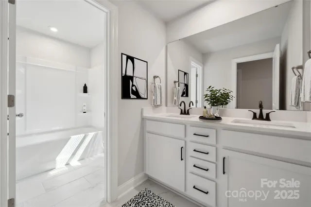 a bathroom with a sink a mirror and a shower