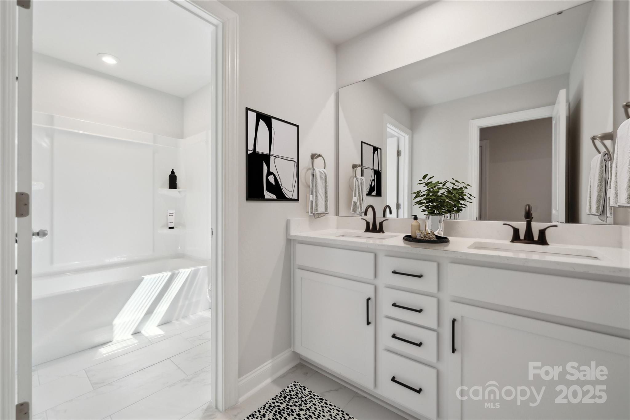 204 Balboa Street Matthews, NC 28104 - Photo 18 of 33 a bathroom with a sink a mirror and a shower