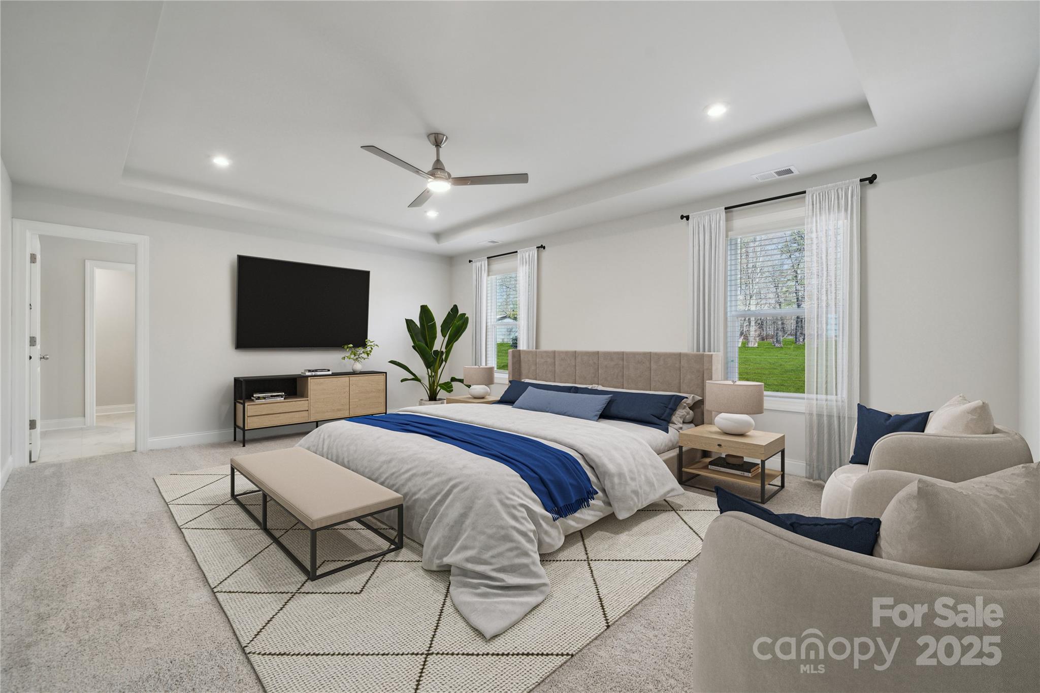 204 Balboa Street Matthews, NC 28104 - Photo 3 of 33 a spacious bedroom with a large bed and a flat screen tv