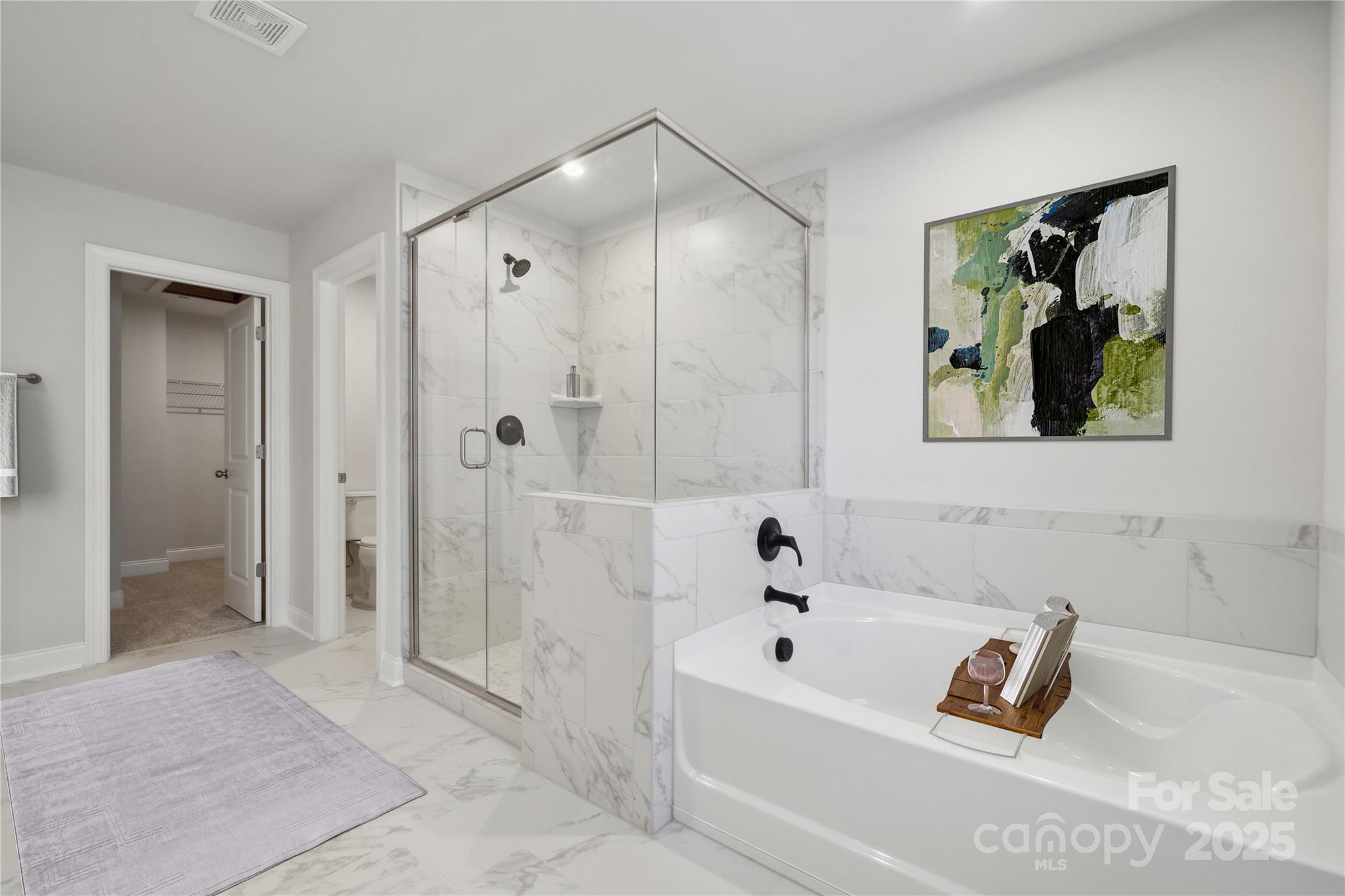 204 Balboa Street Matthews, NC 28104 - Photo 5 of 33 a bathroom with a bathtub and a shower
