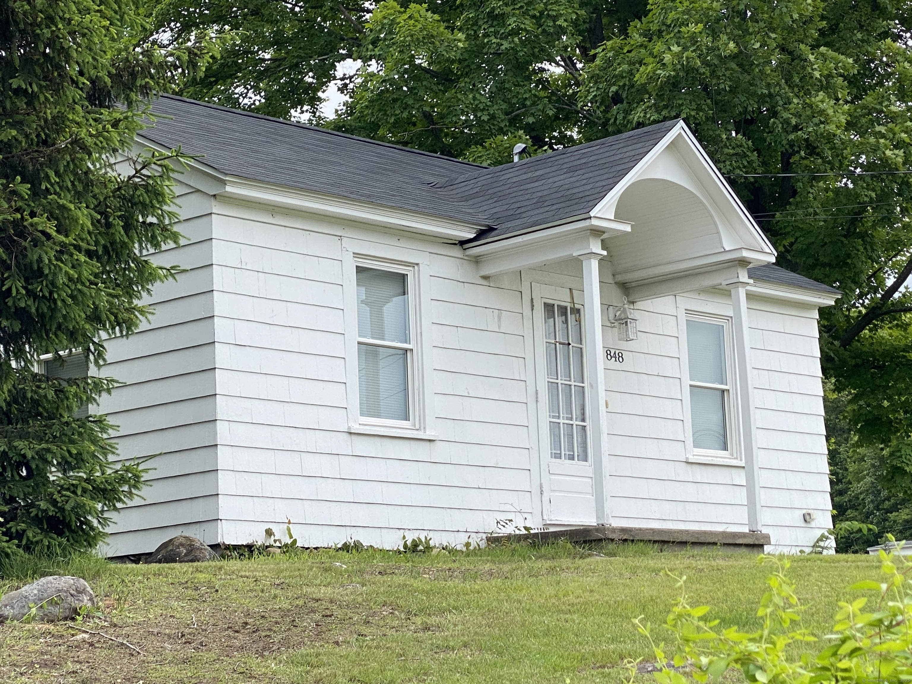 a front view of a house with a yard
