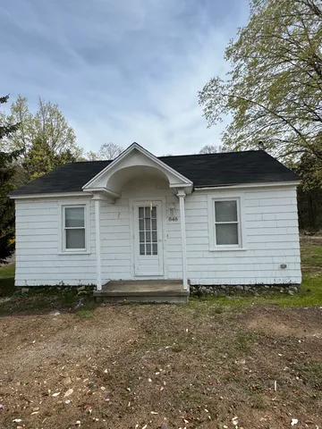 a house with trees in the background