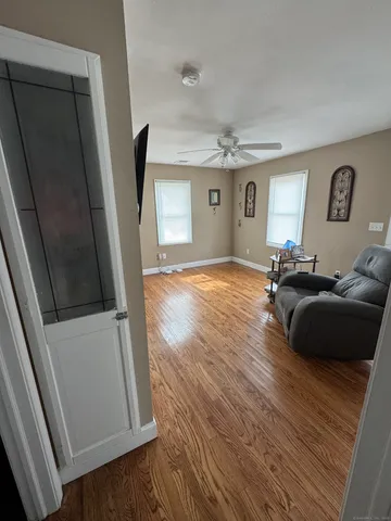 a living room with furniture and a window
