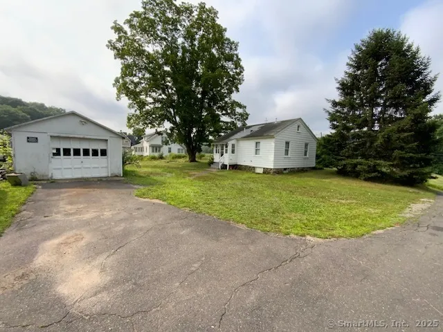 a house with huge green field in front of it