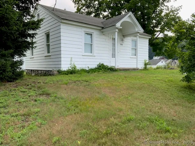 a view of a backyard of the house