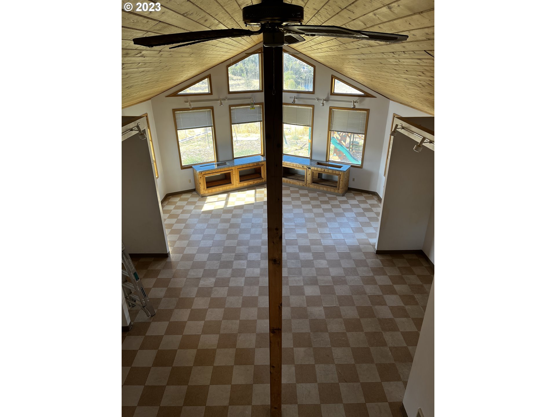 304 Elrod Place Maupin, OR 97037 - Photo 19 of 25 a view of a living room with a floor to ceiling window