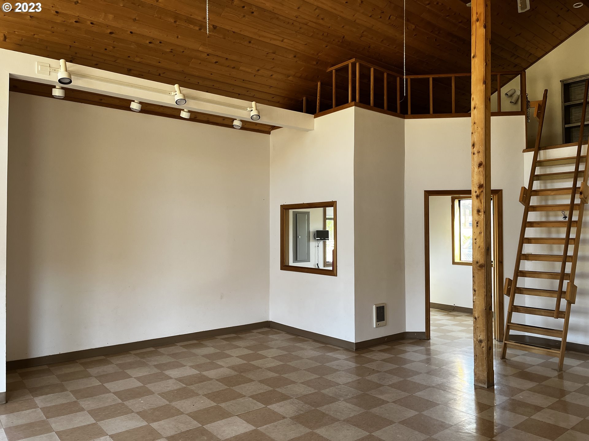 304 Elrod Place Maupin, OR 97037 - Photo 20 of 25 a view of a hallway with wooden floor and staircase