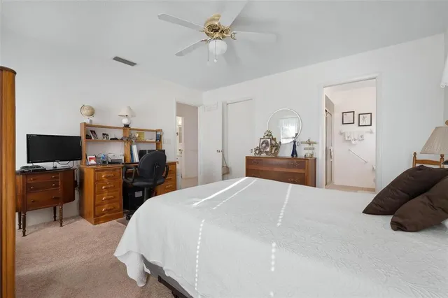 a bedroom with a bed and furniture