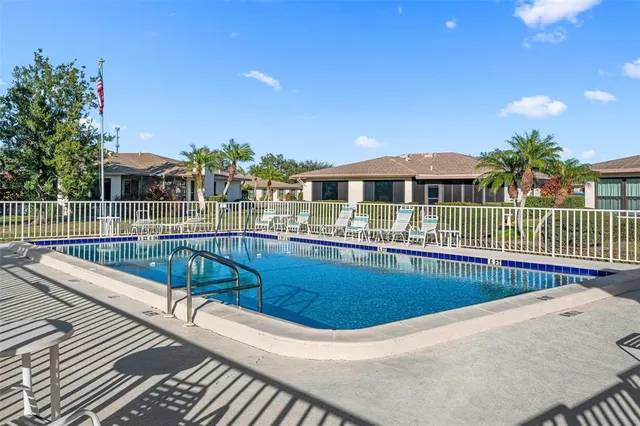 a view of a patio with a table and chairs
