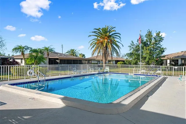a view of a swimming pool with a lounge chair