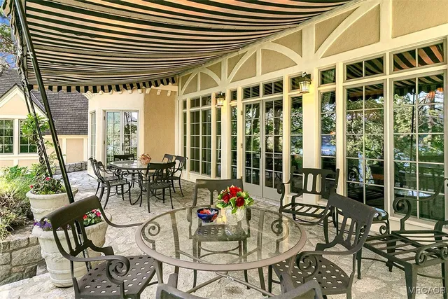 a view of a dining room with furniture and window