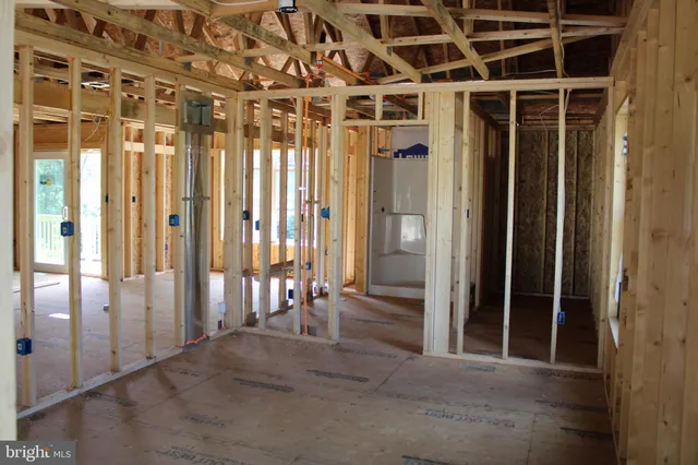 a view of entryway with a wooden door