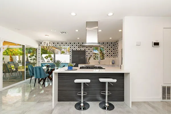 a kitchen with a table and chairs in it