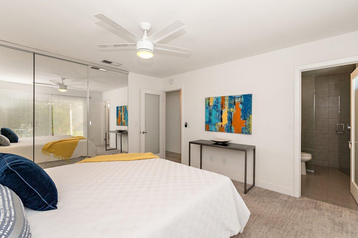 3005 North Chuperosa Road Palm Springs, CA 92262 - Photo 20 of 34 a bedroom with a bed and a chandelier