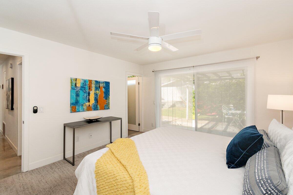 3005 North Chuperosa Road Palm Springs, CA 92262 - Photo 21 of 34 a bedroom with a bed and a large window