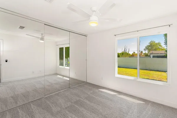 a view of an empty room with a window