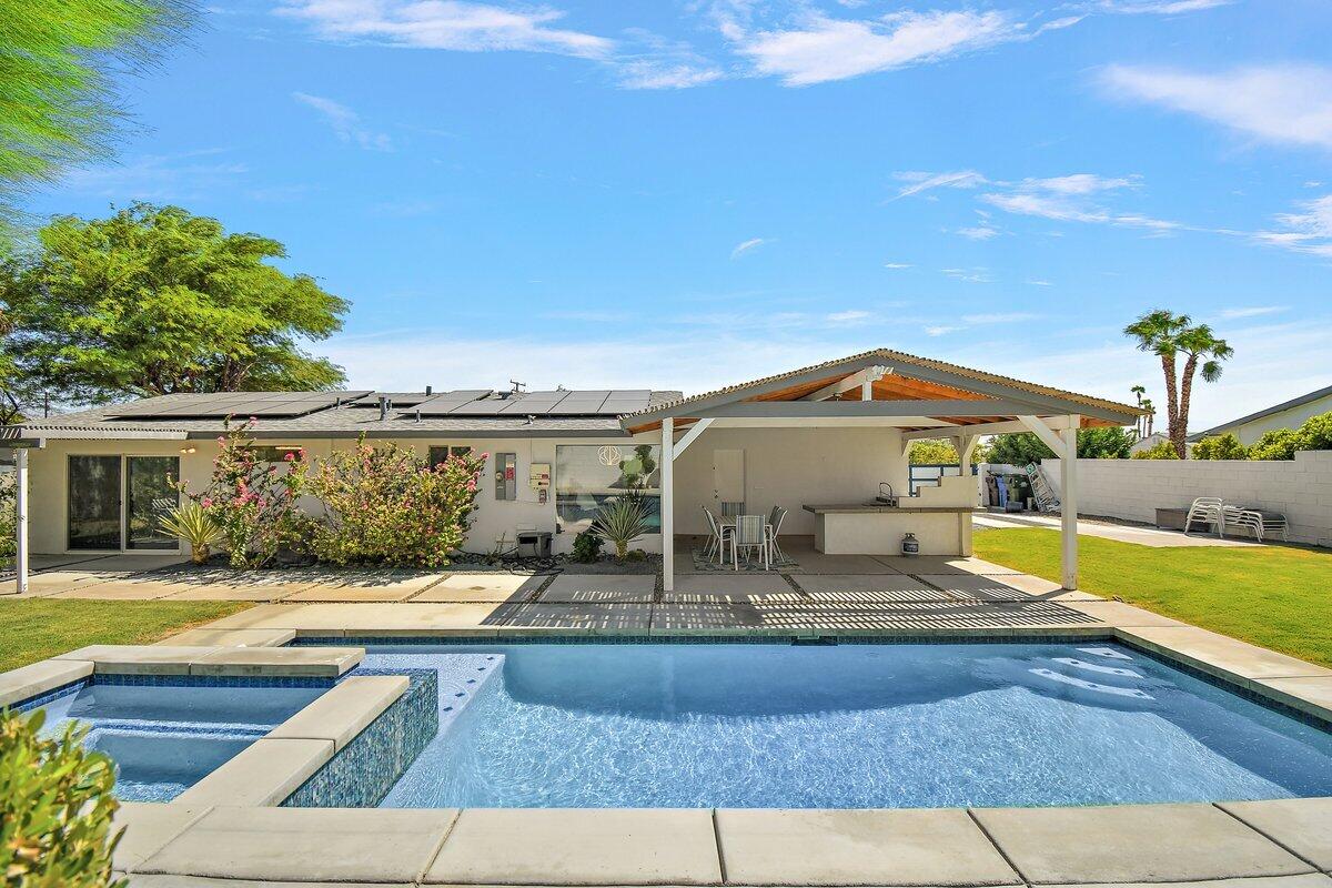 3005 North Chuperosa Road Palm Springs, CA 92262 - Photo 3 of 34 a view of a swimming pool with a lounge chair