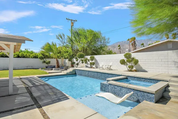 a view of a swimming pool with a patio