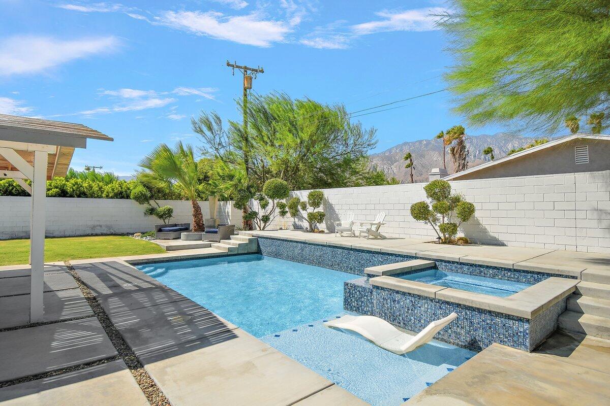 3005 North Chuperosa Road Palm Springs, CA 92262 - Photo 4 of 34 a view of a swimming pool with a patio