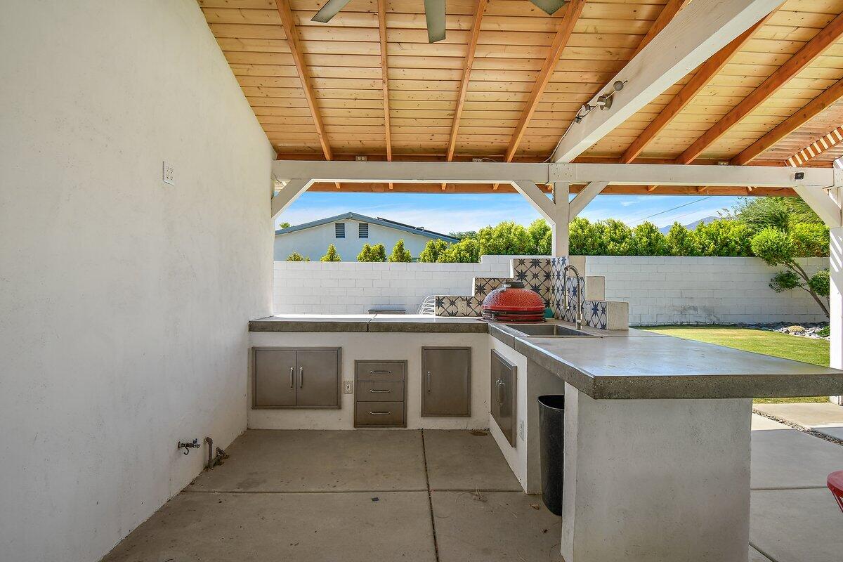 3005 North Chuperosa Road Palm Springs, CA 92262 - Photo 6 of 34 a kitchen with a sink a counter and window