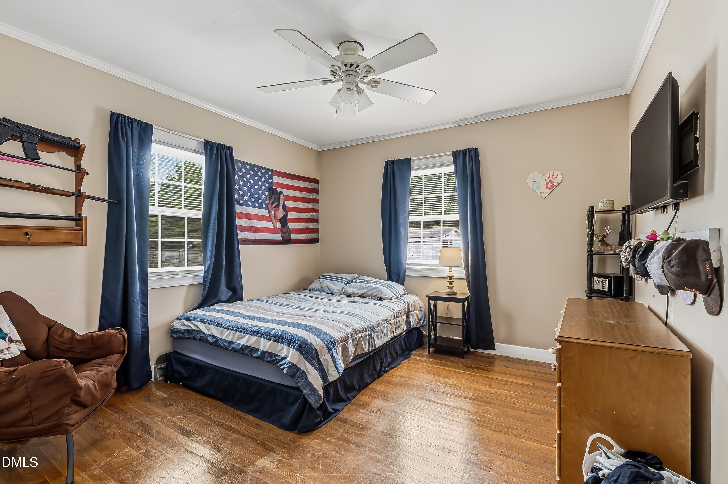 4967 Highway 581 Spring Hope, NC 27882 - Photo 32 of 44 a bedroom with a bed window and a flat screen tv