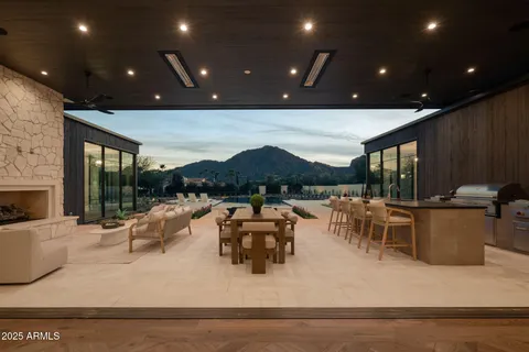 a front view of a house with a yard table and chairs